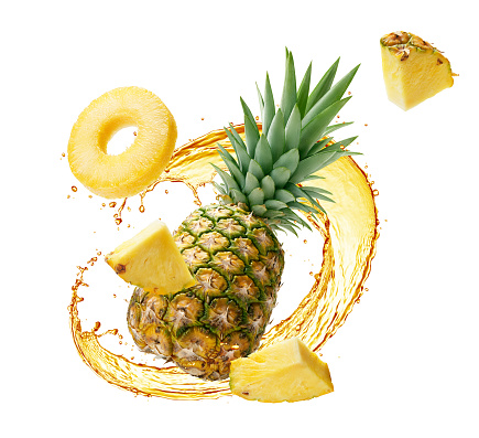 Pineapple juice splashing with its fruit over white background