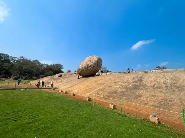 Photo of Mahabalipuram, Tamil Nadu, India. 11 Mar 23 . Krishna's butterball - balancing giant natural rock stone . Mahabalipuram, Tamil Nadu, India