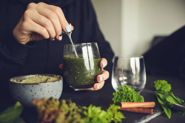 istock Making healthy green cocktail, in the kitchen 1481311736