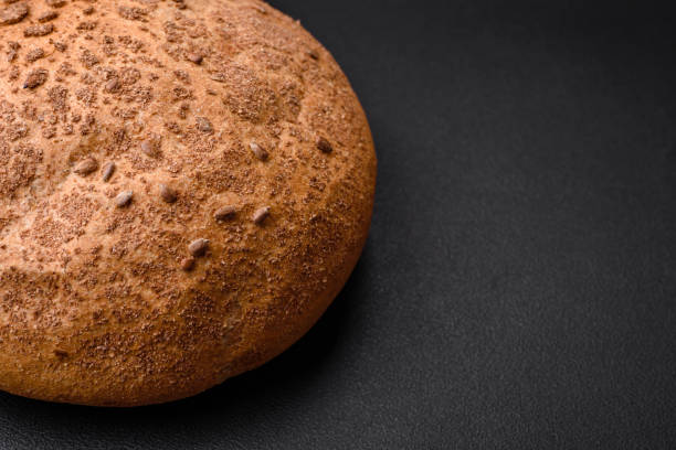 istock Fresh crispy brown bread with sesame seeds and spices 1481311805