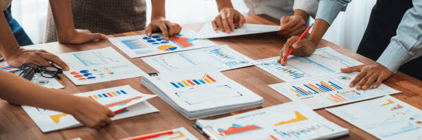 istock Analyst team utilizing BI Fintech to analyze financial dashboard. Scrutinize 1481312541