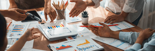 istock Analyst team utilizing BI Fintech to analyze financial dashboard. Scrutinize 1481312633