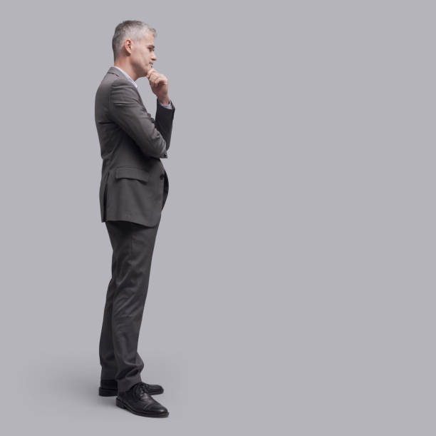 istock Corporate businessman standing side view 1481313804