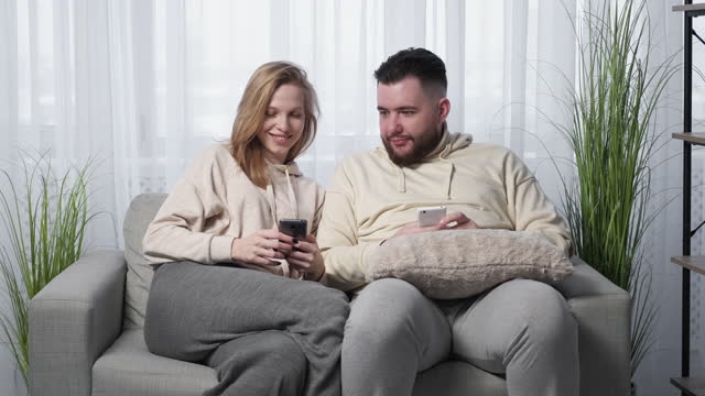Mobile game relaxed couple home entertainment