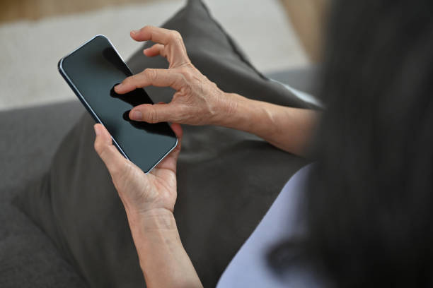 istock Smiling senior woman in casual clothes using smart phone, browsing wireless internet or chatting online. 1481317657