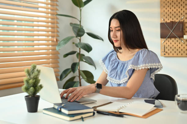 istock Young female entrepreneur chatting with client online on laptop computer, working on online marketing at home office. 1481319385