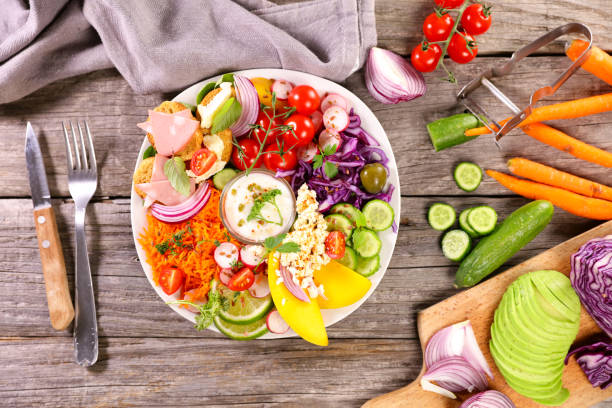 istock mixed vegetable salad and bowl of sauce 1481319496