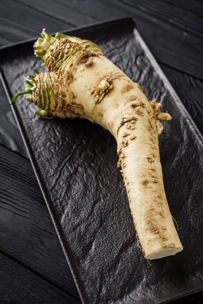 istock aromatic horseradish root on a black rustic wooden background 1481319867