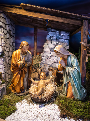 Figures of a traditional nativity scene: cave with shepherds: Jesus, Maria and Jose
