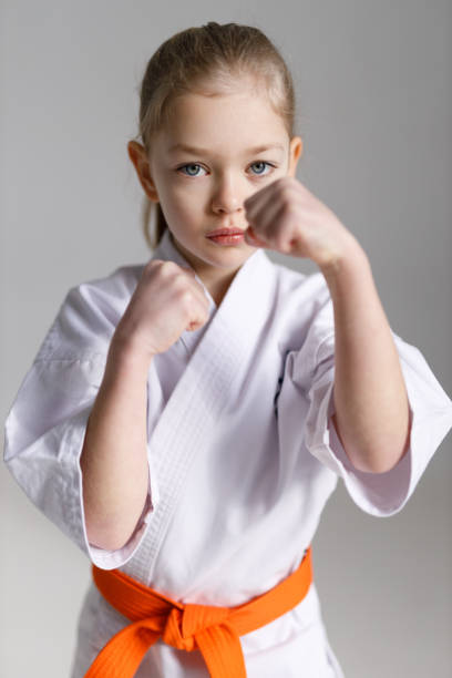 istock Defensive position in karate, child girl in training. 1481328148