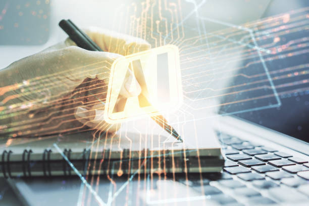 Double exposure of creative artificial Intelligence icon with hand writing in notebook on background with laptop. Neural networks and machine learning concept stock photo
