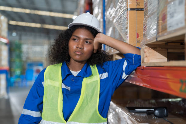 istock African American female warehouse worker working with stressed feeling, worry, boring or unhappy in warehouse. Upset woman worker at work. Unhappy black female worker working in storehouse 1481331689