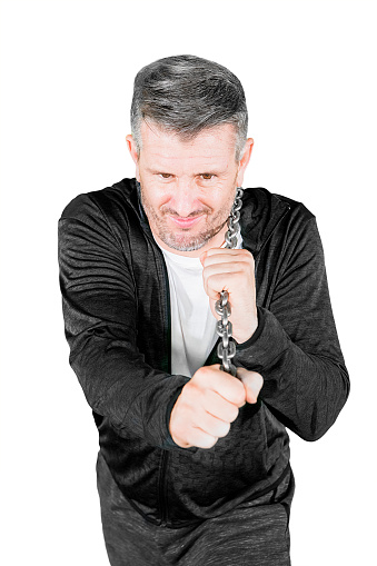 Caucasian man pulling a chain isolated over white background
