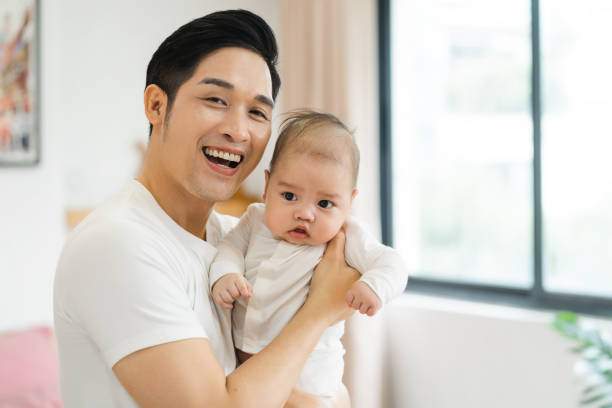 istock image of asian father and son at home 1481336045