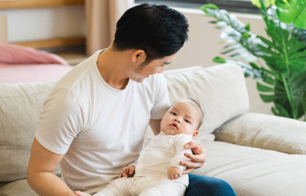 istock image of asian father and son at home 1481336092