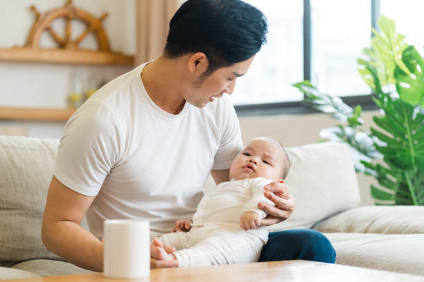 istock image of asian father and son at home 1481336095