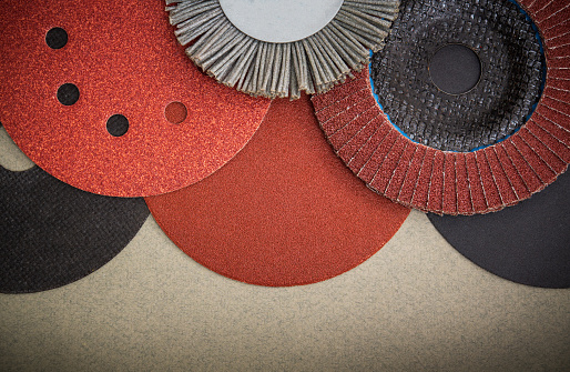 Big set of abrasive tools and sandpaper used for cleaning or grinding products. Industrial tools