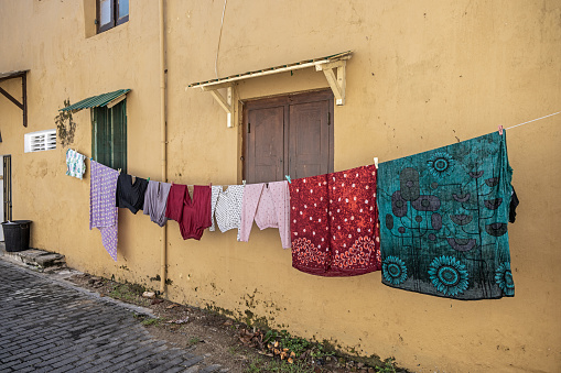 Washing clothes put out to dry on a line in the street in Galle the most southern city in Sri Lanka