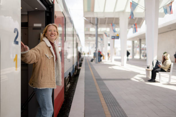 istock Happy woman enjoying while getting out of the train. 1481340848