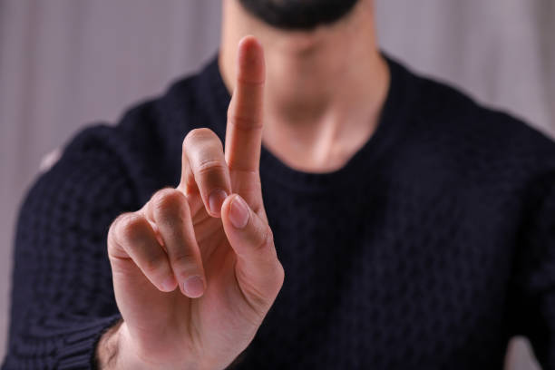 istock Young man raising his index finger up. 1481347936