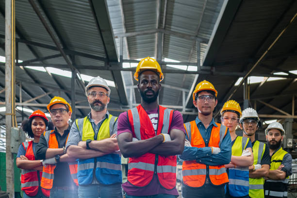 istock Group of various nationalities engineer professional successful team corporate workers standing in factory. teamwork technician inspector manufacturing industry workplace. Full team heavy industrial factory concept. 1481347945