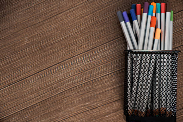 Workplace office with wooden table . Top view from above of notebooks with pens and clips. Flat lay, Business-finance or education concept with copy space.