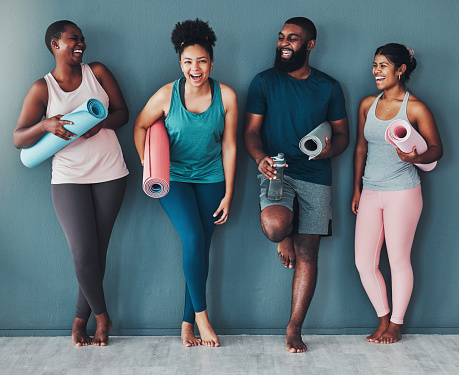 Fitness, diversity and portrait friends at the gym for training, laughing and happy for exercise at a club. Smile, sports and man with women in a group for a workout, cardio or yoga in a room
