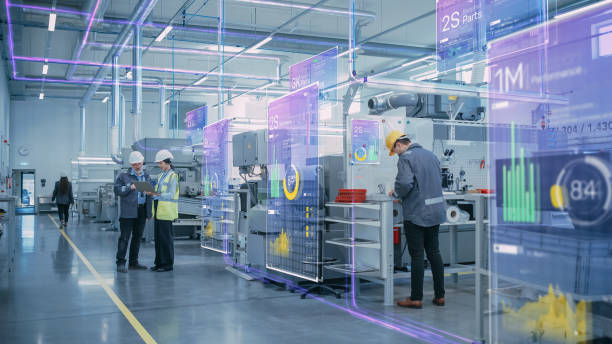 factory digitalization: two industrial engineers use tablet computer, big data statistics visualization, optimization of high-tech electronics facility. industry 4.0 machinery manufacturing products - fábrica imagens e fotografias de stock