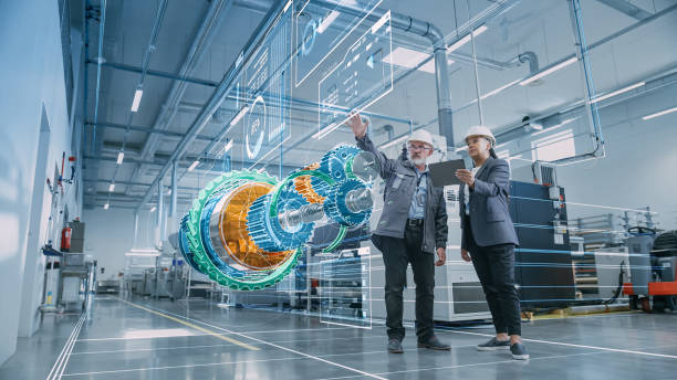 factory digitalization: two industrial engineers use tablet computer, visualize 3d model of clean green energy engine. industry 4 high-tech electronics facility with machinery manufacturing products - ingenjörsvetenskap bildbanksfoton och bilder
