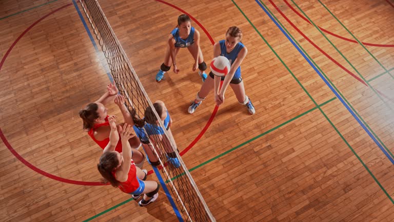 SLO MO LD Red female volleyball team blocking the opponent