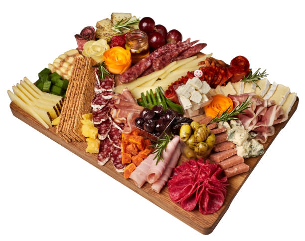 istock Appetizers boards with assorted cheese, salami, ham, grape and nuts. Charcuterie and cheese platter. Top view. Isolated. 1481356338