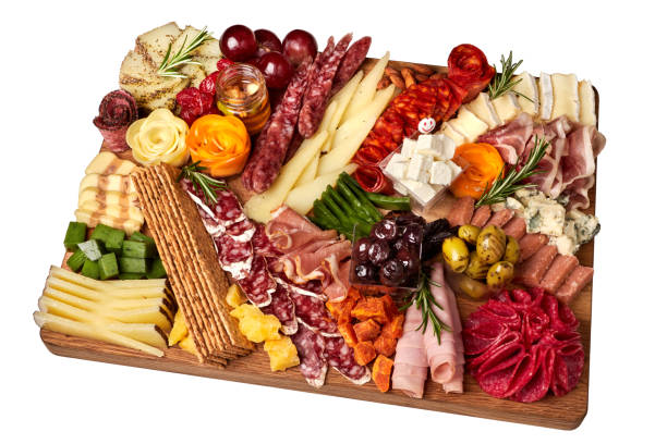 istock Appetizers boards with assorted cheese, salami, ham, grape and nuts. Charcuterie and cheese platter. Top view. Isolated. 1481356860