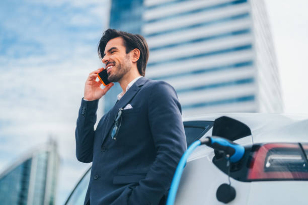 istock Businessman charging an electric car 1481357382