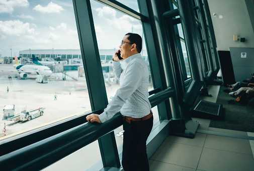 Portrait of businessman using cell phone