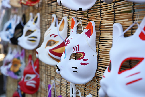 In Kawagoe, Japan, where an old traditional festival is held, unique Japanese masks are displayed. Fox masks with unique smiling expressions and cat masks are lined up, adding to the festive atmosphere of the autumn festival.