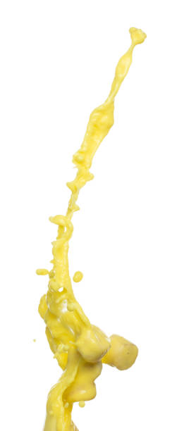 istock Banana juice flying fall down, yellow banana chopped slice juice wave explode. Yellow paint color splash throwing in Air. White background Isolated high speed shutter, throwing freeze stop motion 1481361465