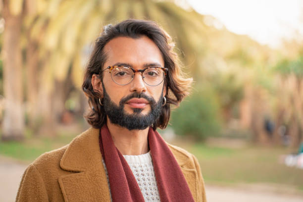 istock Attractive hipster portrait outdoors in the park. Young man looking at camera. 1481367134