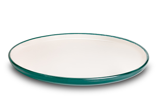 Empty green cersmic plate with green edge. View of green ceramic plate isolated on white background with clipping path