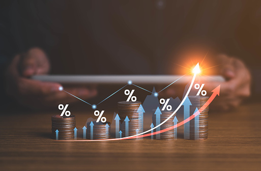 Interest rate and dividend concept. Businessman with percentage symbol and up arrow, Interest rates continue to increase, return on stocks and mutual funds, long term investment for retirement.