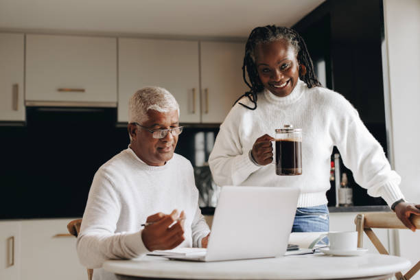 istock Happy mature woman bringing her working husband some coffee 1481373200