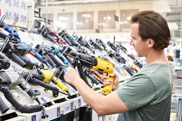 istock Man shopping drill in hardware store 1481375089