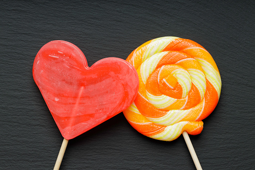 colored lollipops in red and yellow/orange