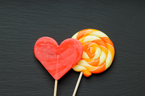colored lollipops in red and yellow/orange