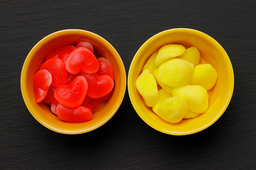 coloured red and yellow jelly beans in a bowl