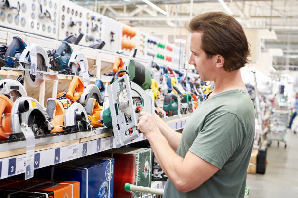 istock Man chooses electric saws in store 1481375699