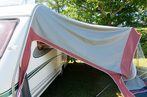 Awning has broken- awning attached to touring caravan has collapsed during windy weather , and needs repairing to prepare it for family vacation.