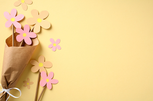 Postcard template for Mother's Day. Bouquet of flowers made of colored cardboard, a children's craft