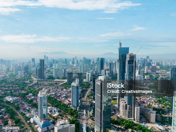 Beautiful Jakarta Cityscape With Misty Mountain Stock Photo - Download Image Now - Jakarta, Urban Skyline, Aerial View
