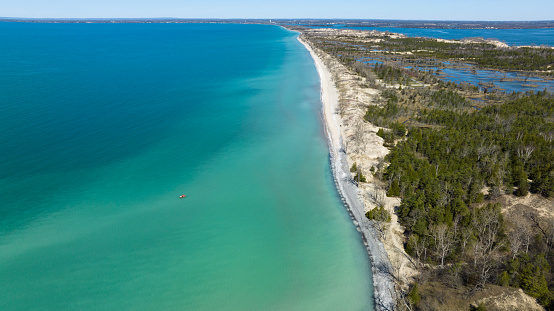 Aerial photograph of white sand beaches and Lake Ontario in Sandbanks Provincial Park in Prince Edward County, Ontario