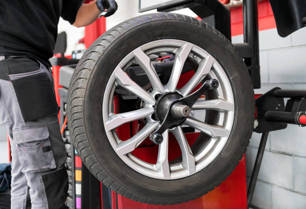 istock Wheel on rack near mechanic 1481387407